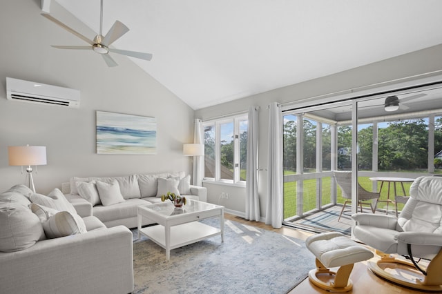 living room featuring light wood-type flooring, high vaulted ceiling, an AC wall unit, and ceiling fan