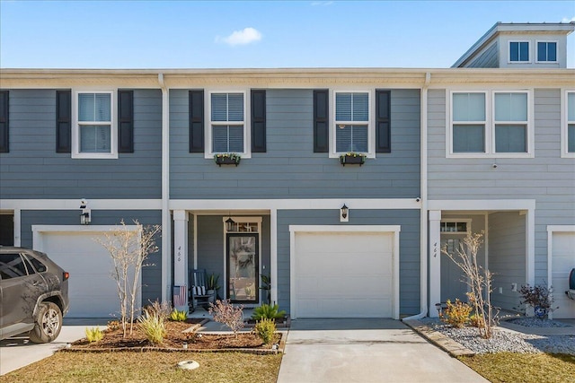 townhome / multi-family property featuring a garage