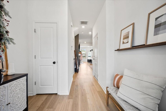 hallway with light wood-type flooring