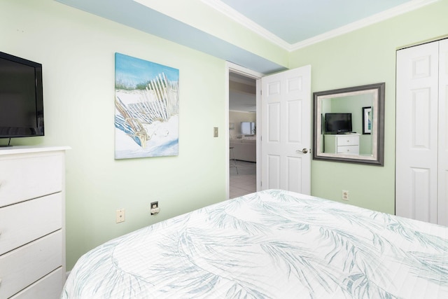 bedroom with a closet and ornamental molding