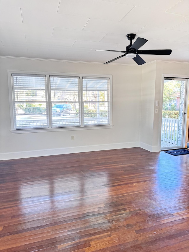 empty room with dark hardwood / wood-style floors and ceiling fan