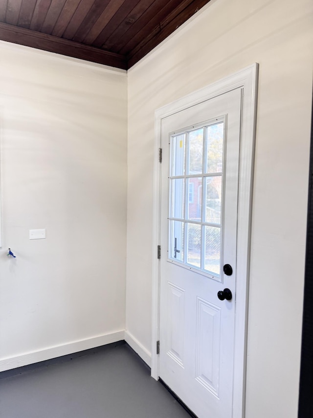 entryway with wood ceiling and crown molding