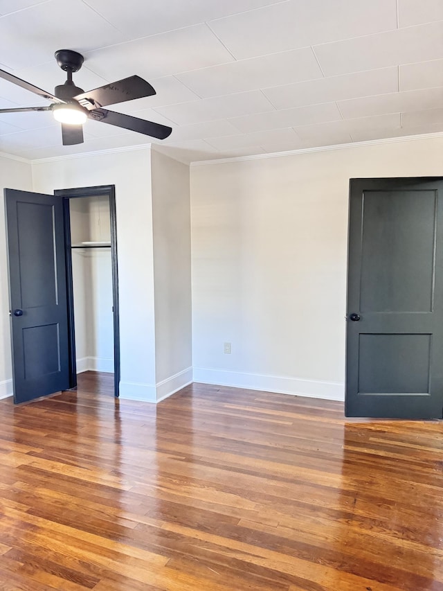 unfurnished bedroom with ceiling fan, a closet, and wood-type flooring