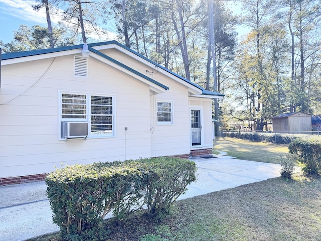 view of side of property featuring a patio area