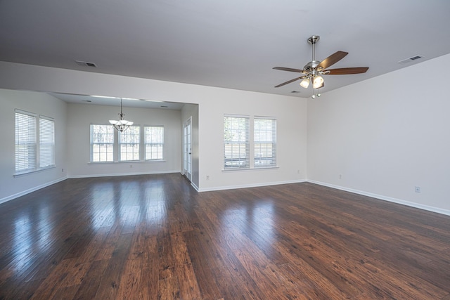 spare room featuring a wealth of natural light, dark wood-style flooring, and visible vents