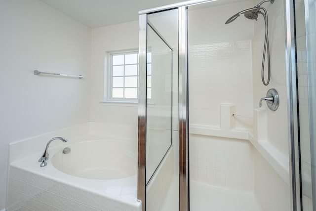 full bathroom with a garden tub and a shower stall