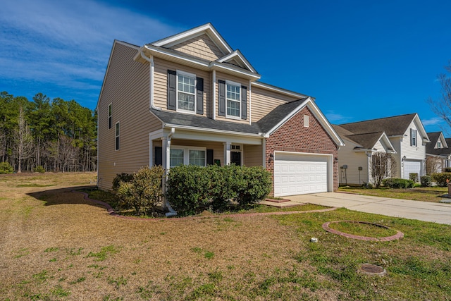 view of front of property with driveway, brick siding, a front lawn, and an attached garage