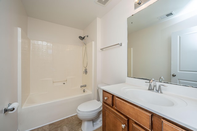 bathroom with toilet, bathing tub / shower combination, vanity, and visible vents