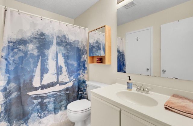 bathroom featuring visible vents, curtained shower, toilet, and vanity