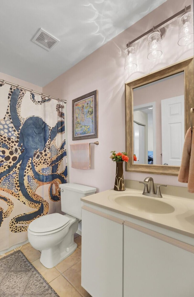 full bathroom with vanity, a shower with curtain, visible vents, tile patterned floors, and toilet