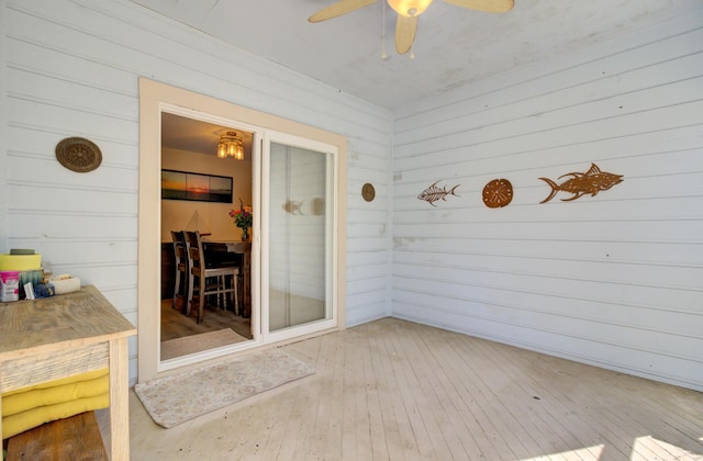 sunroom / solarium with ceiling fan