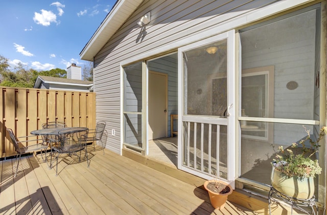 wooden deck with outdoor dining area