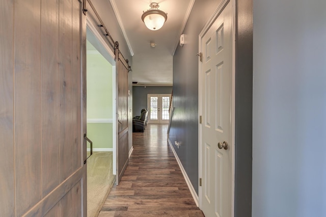 5105 Parrum Ct, Summerville, SC 29485 - corridor featuring a barn door, ornamental molding, and dark wood-type flooring