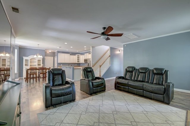 5105 Parrum Ct, Summerville, SC 29485 - living area featuring ceiling fan, light wood-style flooring, crown molding, stairway, and recessed lighting