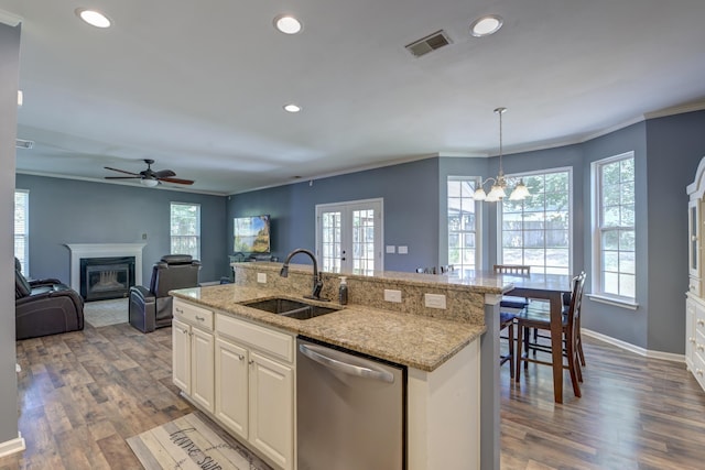 5105 Parrum Ct, Summerville, SC 29485 - kitchen featuring dishwasher, a glass covered fireplace, french doors, recessed lighting, and healthy amount of natural light