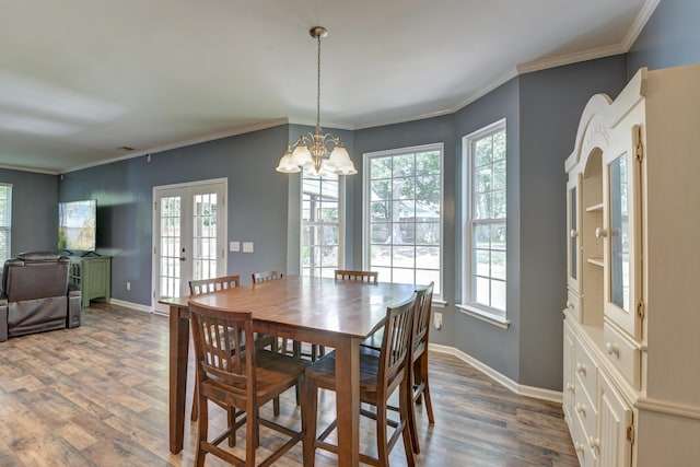 5105 Parrum Ct, Summerville, SC 29485 - dining room with plenty of natural light, dark wood finished floors, a chandelier, and crown molding