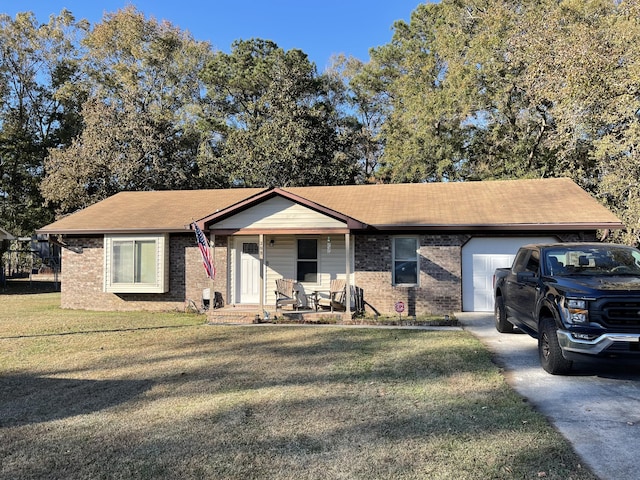 ranch-style home with a front yard and a garage