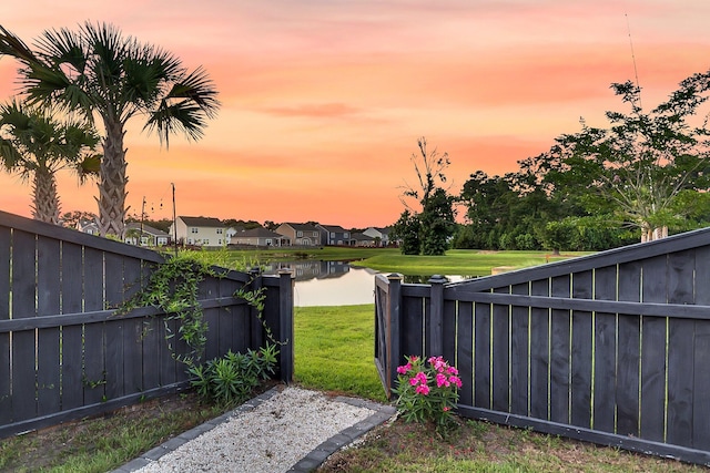 3018 Vincent Astor Dr, Johns Island, SC 29455 - fenced backyard featuring a residential view and a water view