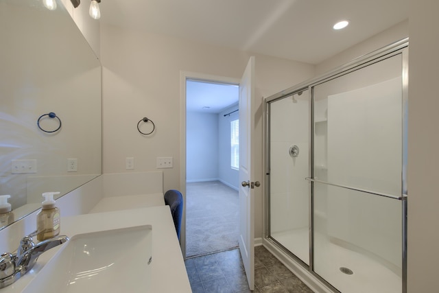 3018 Vincent Astor Dr, Johns Island, SC 29455 - bathroom with a shower with shower door, tile patterned flooring, vanity, and recessed lighting
