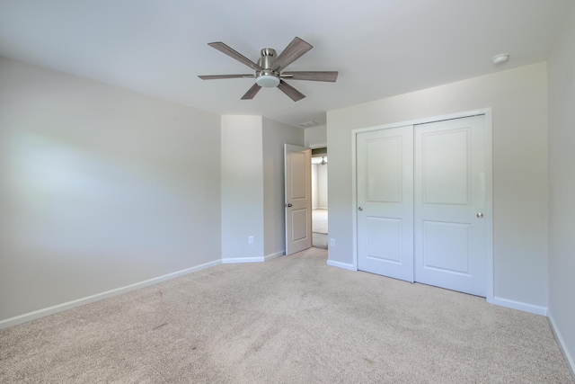 3018 Vincent Astor Dr, Johns Island, SC 29455 - unfurnished bedroom with light carpet, a closet, and a ceiling fan