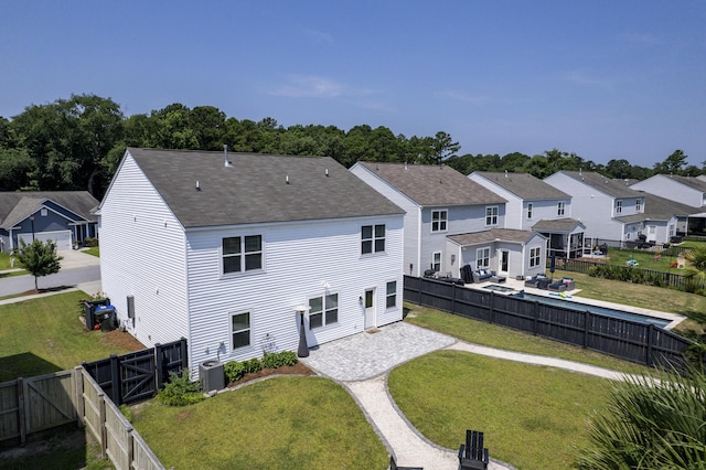 3018 Vincent Astor Dr, Johns Island, SC 29455 - back of house with a residential view, a fenced backyard, a shingled roof, and a patio area