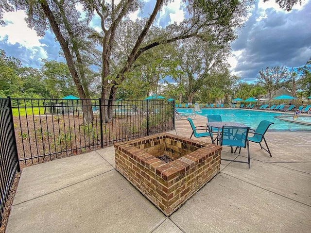3018 Vincent Astor Dr, Johns Island, SC 29455 - view of patio featuring a fire pit and a community pool