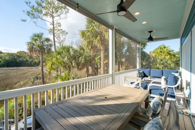 sunroom / solarium with ceiling fan