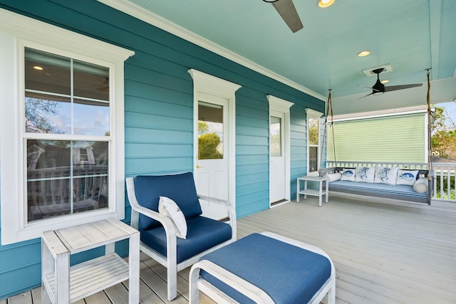 deck featuring a porch and ceiling fan