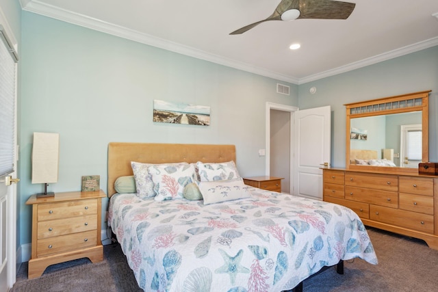 carpeted bedroom with ceiling fan and ornamental molding