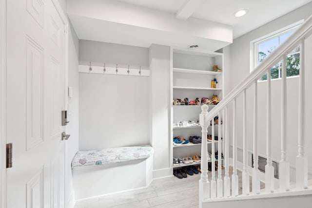 mudroom with light hardwood / wood-style floors