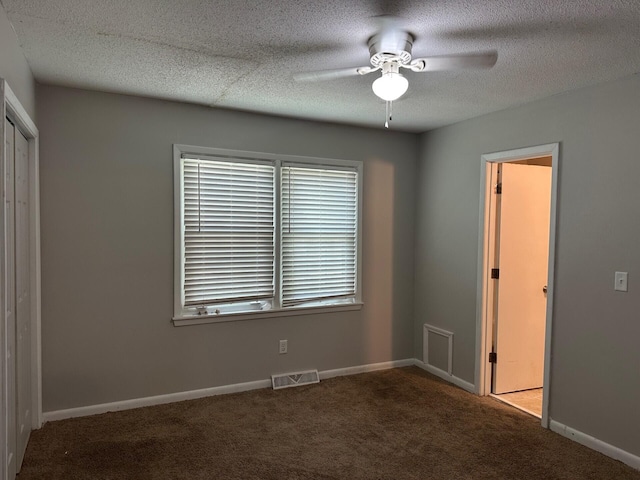 2827 Haverhill Cir N, Charleston, SC 29420 - unfurnished bedroom with carpet floors, a closet, a textured ceiling, and a ceiling fan