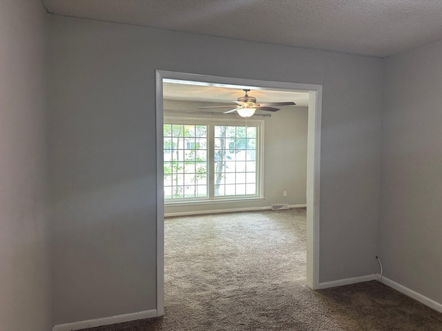 2827 Haverhill Cir N, Charleston, SC 29420 - unfurnished room with carpet, a ceiling fan, and a textured ceiling