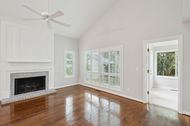 unfurnished living room with a fireplace, dark hardwood / wood-style flooring, high vaulted ceiling, and ceiling fan