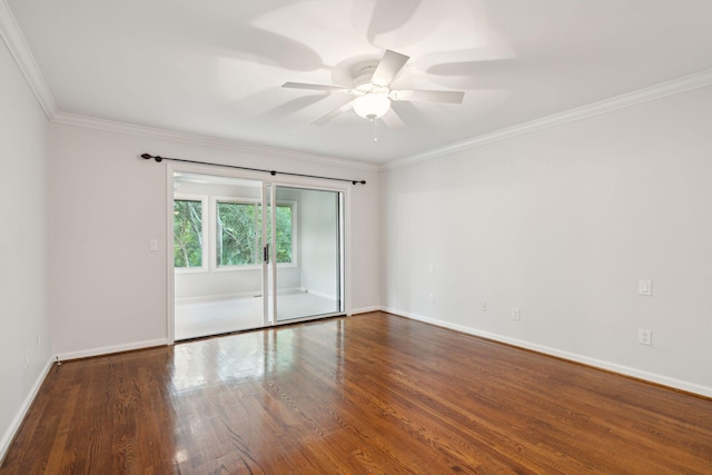 spare room with ceiling fan, hardwood / wood-style flooring, and crown molding