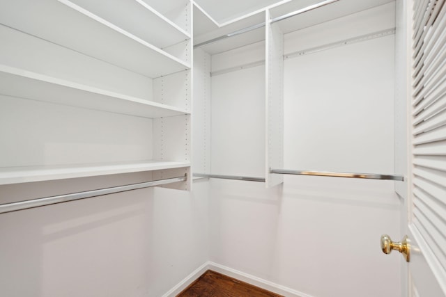 walk in closet featuring hardwood / wood-style flooring