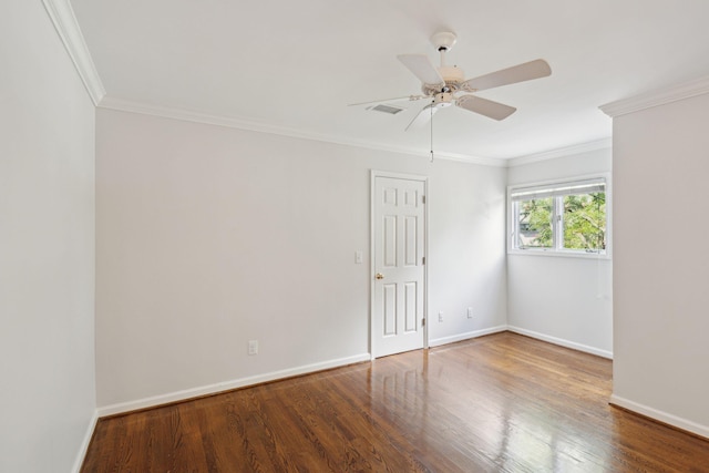 empty room featuring ceiling fan, ornamental molding, and hardwood / wood-style floors