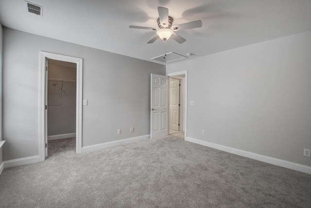 116 Venezia Ct, Ladson, SC 29456 - unfurnished bedroom with carpet, a walk in closet, and baseboards