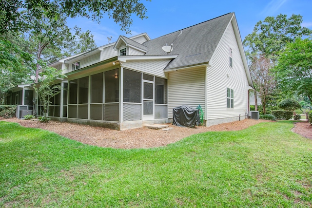 116 Venezia Ct, Ladson, SC 29456 - rear view of house featuring a sunroom, a yard, roof with shingles, and central AC