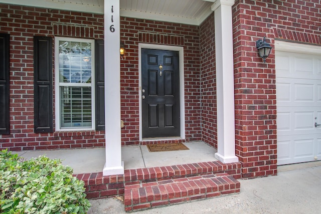 116 Venezia Ct, Ladson, SC 29456 - doorway to property with a porch, brick siding, and an attached garage