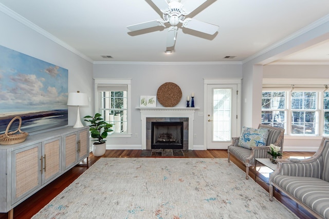 2517 Charter Oaks Dr, Mount Pleasant, SC 29466 - living area featuring a tile fireplace, dark wood-style floors, crown molding, and a ceiling fan