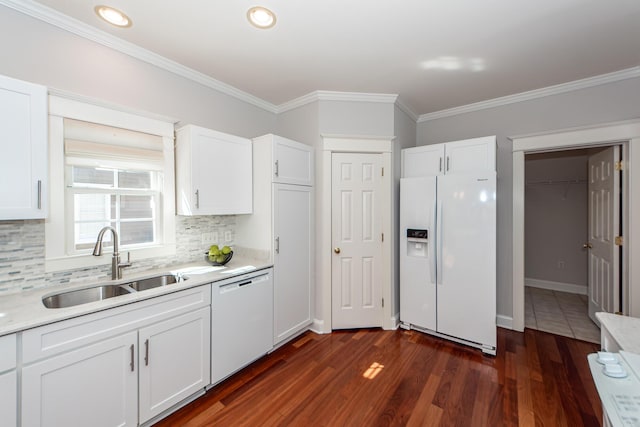 2517 Charter Oaks Dr, Mount Pleasant, SC 29466 - kitchen with white appliances, light countertops, decorative backsplash, white cabinetry, and crown molding