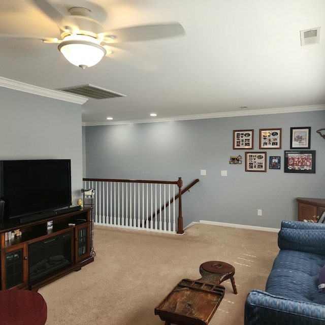 carpeted living room with ornamental molding, ceiling fan, baseboards, and recessed lighting