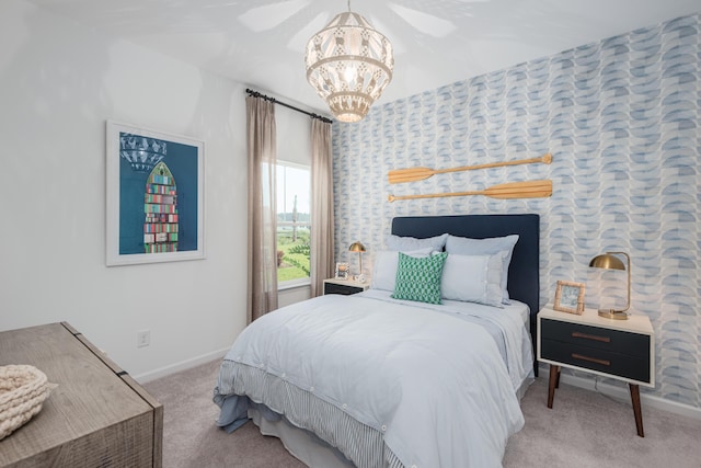 carpeted bedroom featuring a chandelier