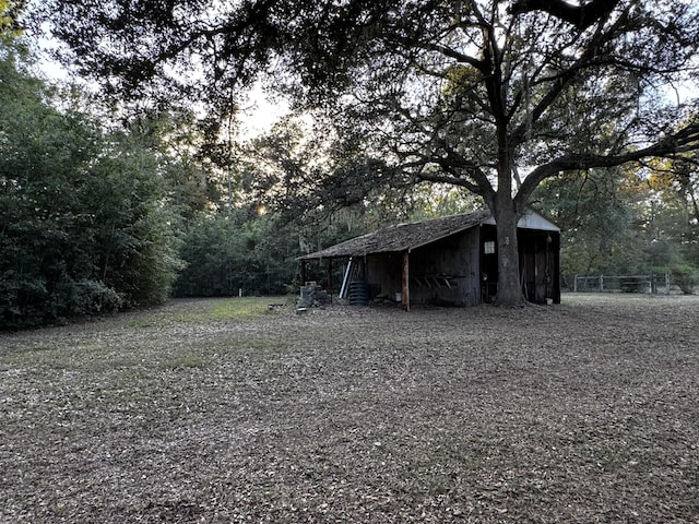 143 Fisk Rd, Dorchester, SC 29437 - view of yard featuring an outdoor structure and a wooded view