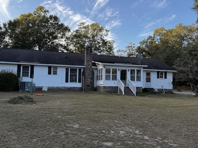 143 Fisk Rd, Dorchester, SC 29437 - rear view of house with a yard, entry steps, a sunroom, and a chimney