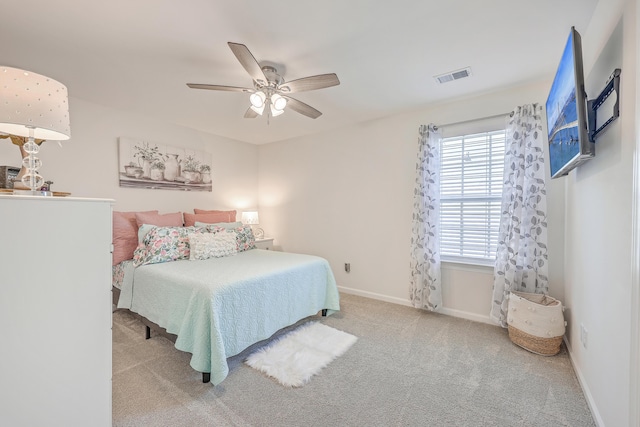 bedroom with carpet floors, baseboards, and ceiling fan