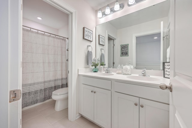 full bathroom featuring toilet, tile patterned floors, double vanity, and a shower with shower curtain