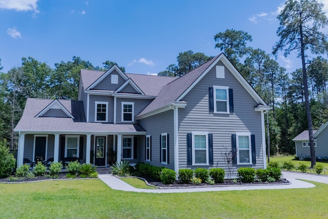 3025 Rampart Rd, Summerville, SC 29483 - traditional-style house featuring covered porch, a front yard, and roof with shingles