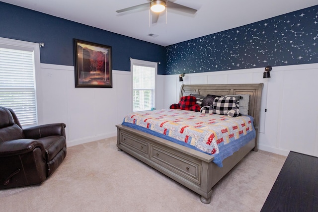 3025 Rampart Rd, Summerville, SC 29483 - carpeted bedroom with a wainscoted wall, ceiling fan, and a decorative wall