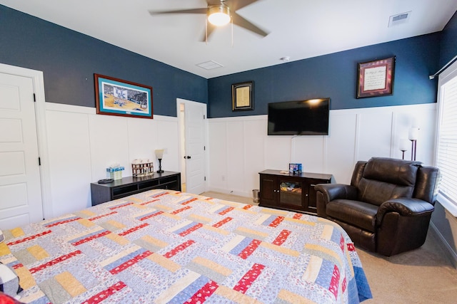 3025 Rampart Rd, Summerville, SC 29483 - bedroom with a decorative wall, a wainscoted wall, carpet flooring, a ceiling fan, and a closet